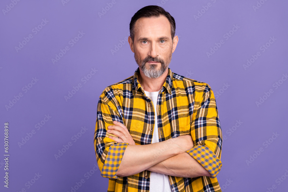 Photo of serious confident man with white gray beard wear yellow plaid shirt standing arms crossed isolated on purple color background Photo of serious confident man with white gray beard wear yellow plaid shirt standing arms crossed isolated on purple color background