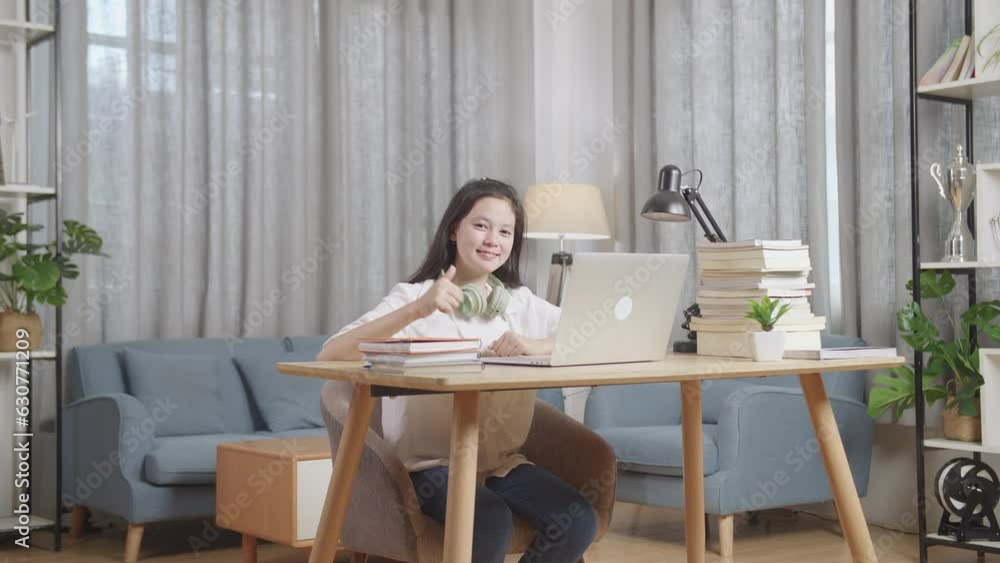 Teen Smiling And Showing Thumbs Up To Camera At Home, Learning Online From Laptop
Teen Smiling And Showing Thumbs Up To Camera At Home, Learning Online From Laptop