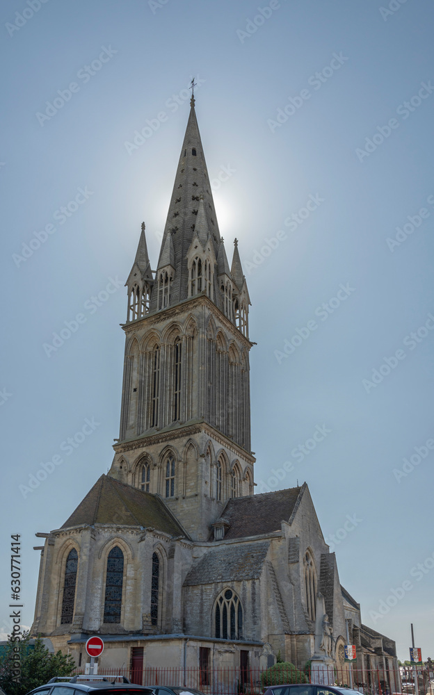 Obraz premium Langrune-Sur-Mer, France - 07 18 2023: View of the facade of the St. Martin's Church from the road.