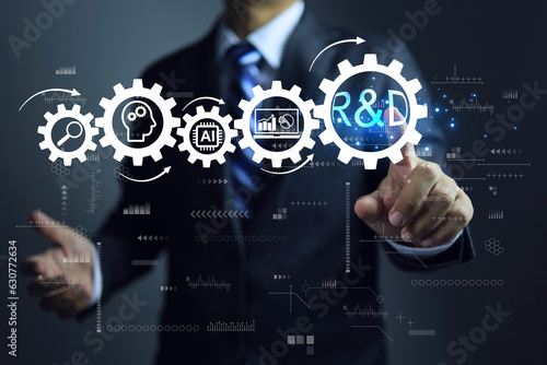Businessman pointing on R and D cog research and development and gear icons as a continuous process. New product development or software development concept. Using AI in the design process.