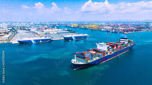 Large cargo ships are docked at a large export warehouse in an industrial zone. photo