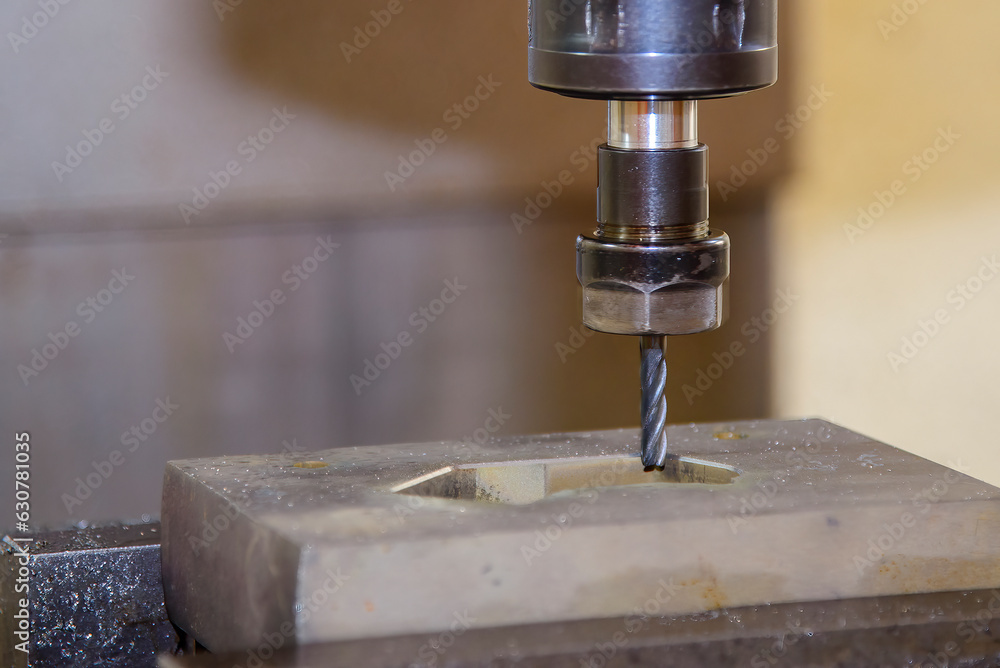 The CNC milling machine cutting injection mold part by solid ball end mill tool in the light blue scene. The CNC milling machine cutting injection mold part by solid ball end mill tool in the light blue scene.
