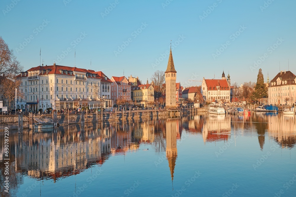 the view from across a large body of water, with buildings lining the edge and