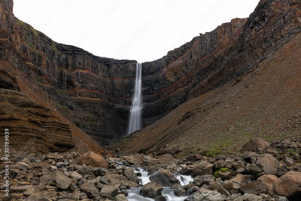 Majestic Hengifoss waterfall cascading down a rocky terrain