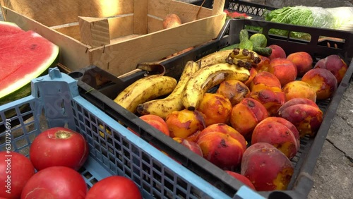 Rotten spoiled fruits and vegetables utilization. Food waste. Discarding unsold food