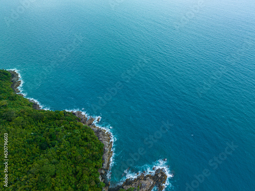 .aerial top view amazing freedom beach small white sand beach with perfect nature. .white wave hit the rock around island. .green forest peaceful. green sea, and clear sand landscape. Paradise beach..