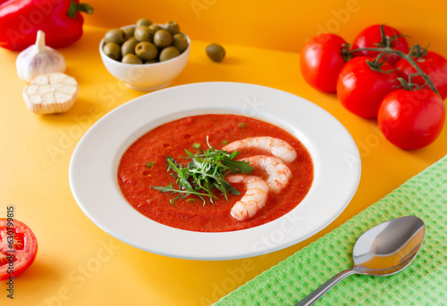 Summer cold soup gazpacho with srimps. Tomato and olives. Colourful photo photo