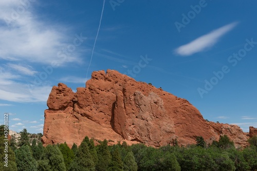 Majestic mountain range with towering red sandstone formations with a sky of brilliant blue hues