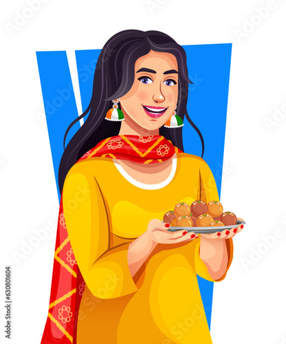 Close-up portrait of a happy Indian young girl holding Indian sweets on the occasion of Independence Day. Celebrating Indian festivals with Indian sweets in hand.