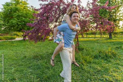 This pic captures a young couple goofin' around in the park. It's all about that joy, good times, fun evening, great relationship, and carefree vibes