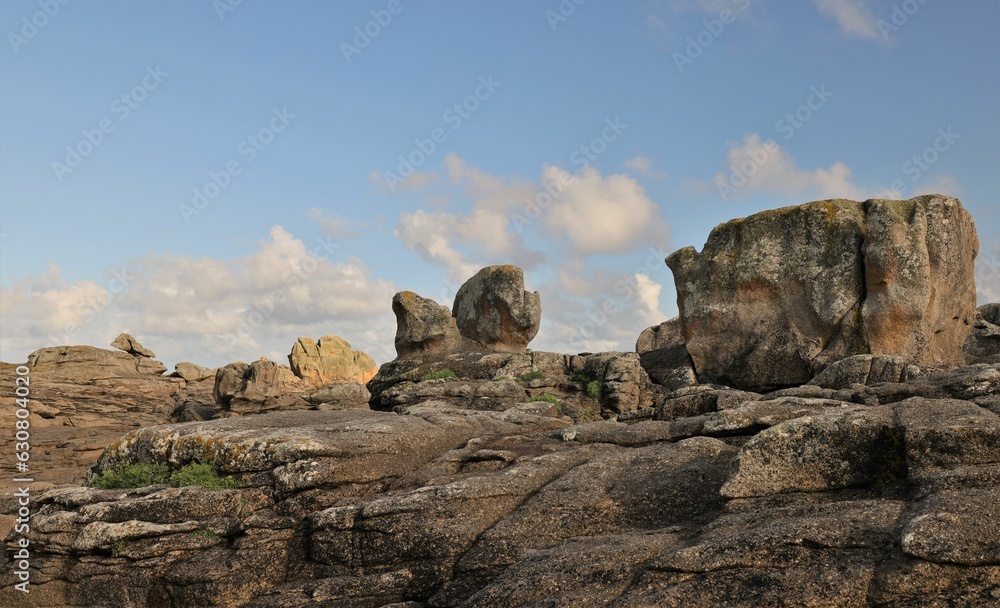 Scenic landscape featuring large rocks situated in the center of a coast, Brittany, France