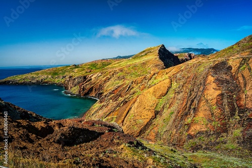 Cliffs with vibrant hues of greens overlooking the ocean