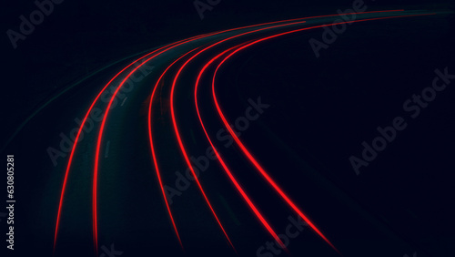 the trail of car lights on the night road, the bend of the night highway
