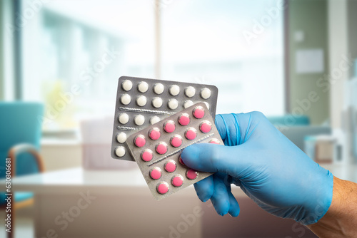 Pills in doctor hand. Medic...
