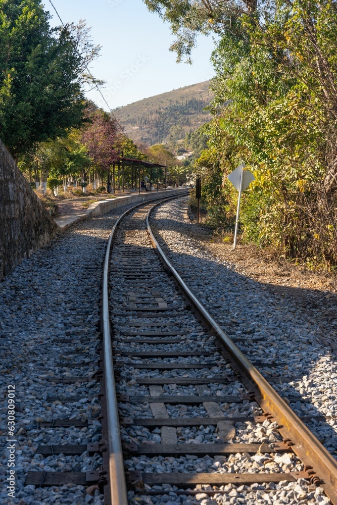 Vertical shot of a winding railway track curves through the landscape Vertical shot of a winding railway track curves through the landscape