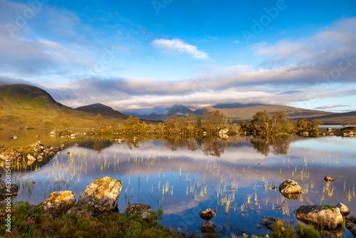 Loch na h-Achlaise, Rannoch Moor, Scotland, on a beautiful early autumn morning. Leaves are turning but are still on trees.