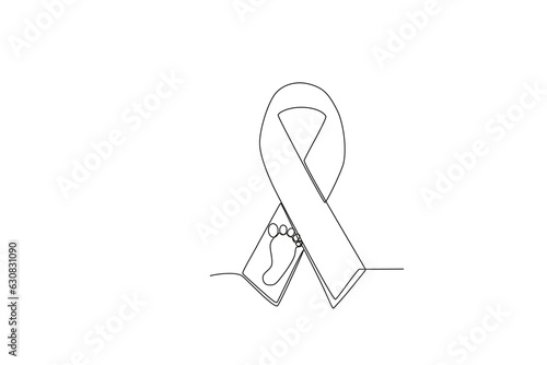 A ribbon with a picture of a baby's feet. Pregnancy and infant loss awareness month