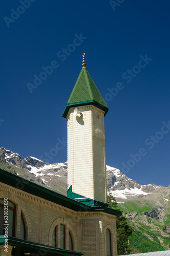 islamic mosque.mosque on the background of blue sky and mountains.