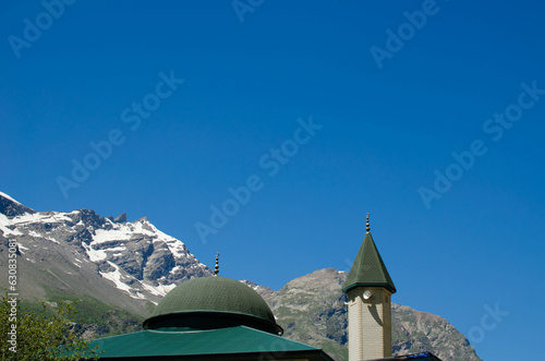 islamic mosque.mosque on the background of blue sky and mountains.