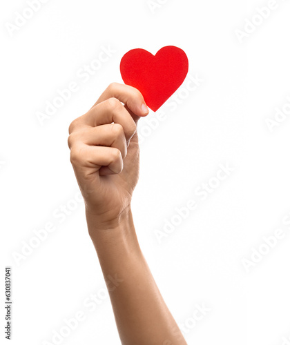 charity, love and health concept - close up of hand holding red paper heart over white background