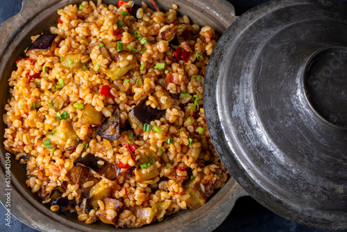 Traditional delicious Turkish food; Bulgur pilaf with eggplant and vegetables. (Turkish name; Patlicanli bulgur pilavi) photo