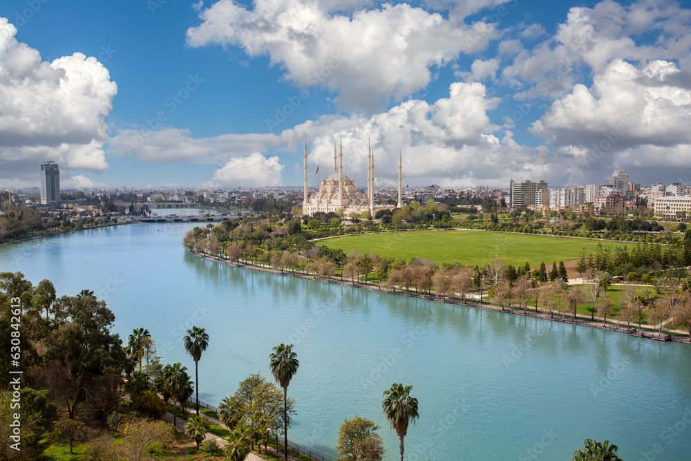 Adana central Sabanci Mosque with Seyhan river, city panoramic and top view, Adana - Turkey.