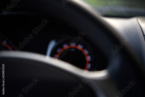 Steering wheel and speedometer in the car. The dashboard of the car.