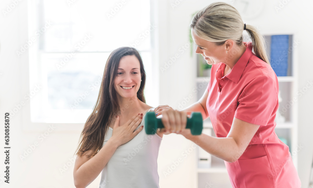 Modern rehabilitation physiotherapy clinic with professional and client Modern rehabilitation physiotherapy clinic with professional and client