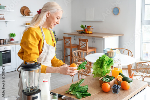Mature woman with fresh veg...