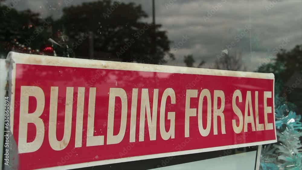 building for sale sign writing caption text in window visible outside ...