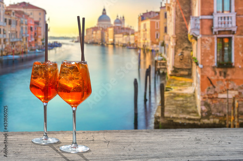 Fotografiet two Aperol Spritz in Venice, in the background the view from the Accademia Bridg