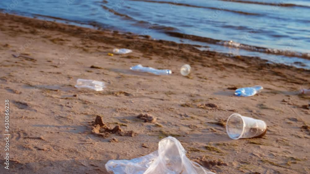 The pile of plastic waste on the seashore reflects a massive ecological disaster and the impact of plastic pollution. Concept of Ecological Disaster, Environmental Pollution, Plastic Hazard The pile of plastic waste on the seashore reflects a massive ecological disaster and the impact of plastic pollution. Concept of Ecological Disaster, Environmental Pollution, Plastic Hazard