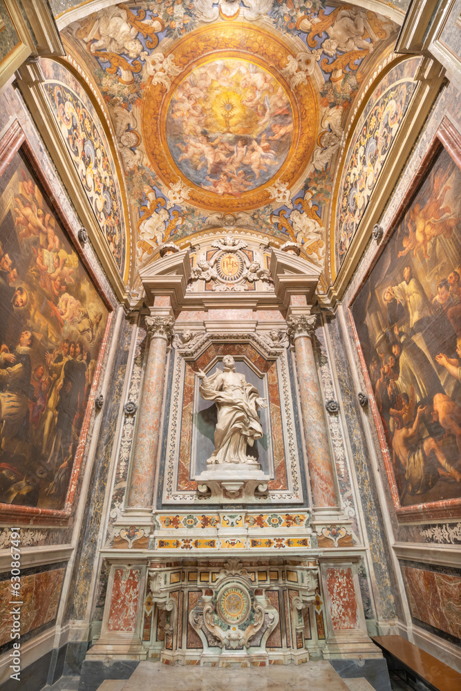NAPLES, ITALY - APRIL 19, 2023: The baroque chapel of St. Francis Borgia in the church Chiesa del Jesu Vecchio with the statue of Holy by  Pietro Ghetti from 17. cent.