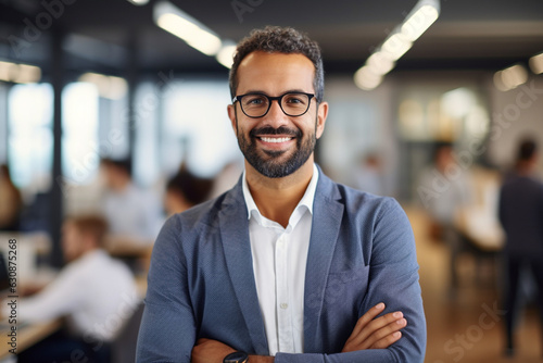 Leader in Innovation: High-Resolution Portrait of a Young Tech CEO Standing in a Bustling Office