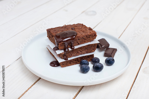 piece of cake with chocolate on a white dish