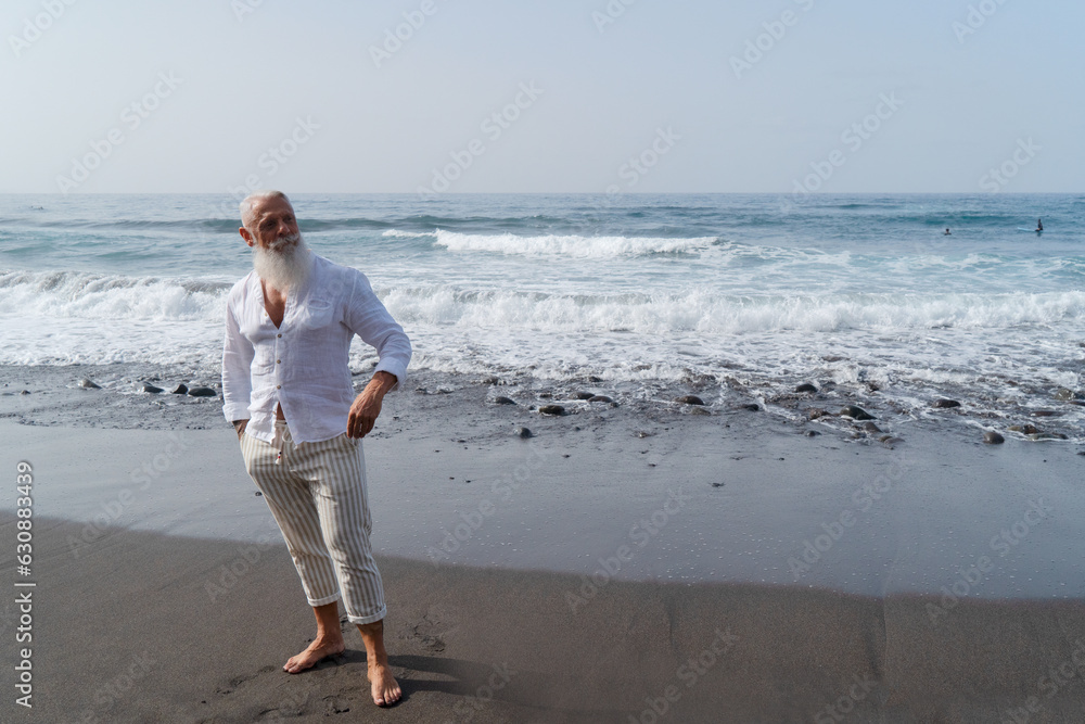 Lonely senior mature man looking at the sea, lonelyness and retirement concept, wide web banner Lonely senior mature man looking at the sea, lonelyness and retirement concept, wide web banner