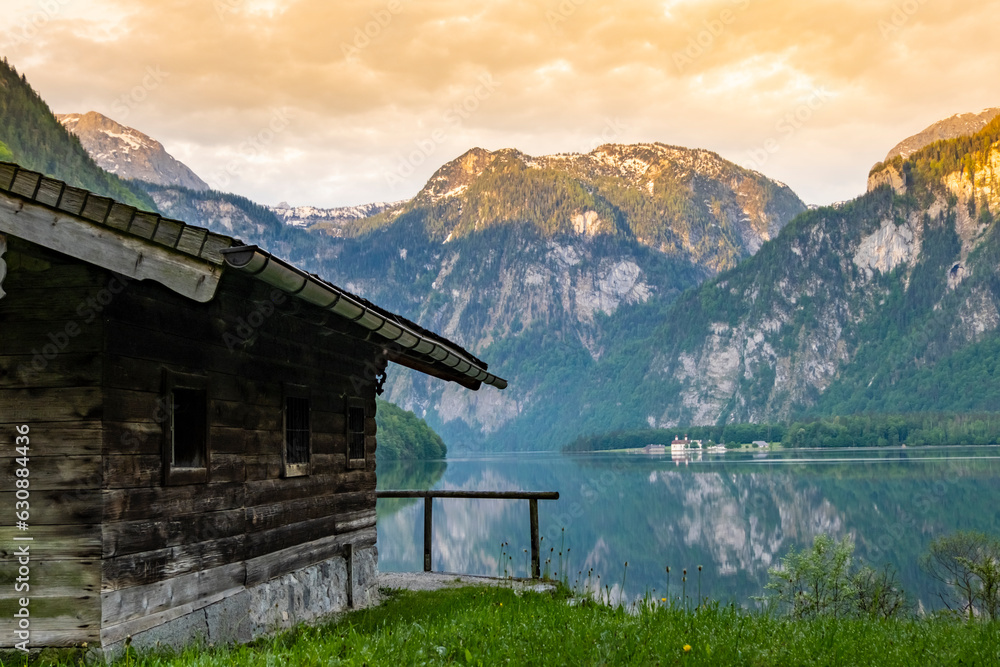 Wooden house on mountain lake Koenigssee Berchtesgaden National Park Bavaria Germany Wooden house on mountain lake Koenigssee Berchtesgaden National Park Bavaria Germany