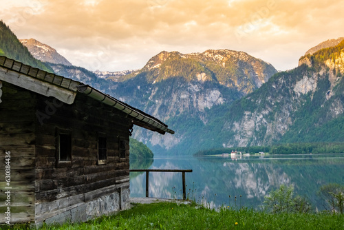 Wooden house on mountain lake Koenigssee Berchtesgaden National Park Bavaria Germany