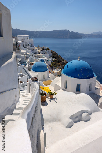 Whitewashed buildings on the edge of the caldera cliff in Oia village, Santorini, Greece