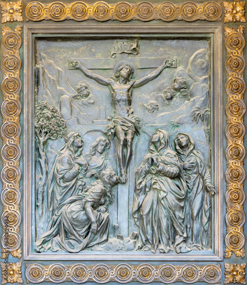 NAPLES, ITALY - APRIL 22, 2023:  The bronze relief of Crucifixion on the gate of church Basilica dell Incoronata Madre del Buon Consiglio from 20. cent.