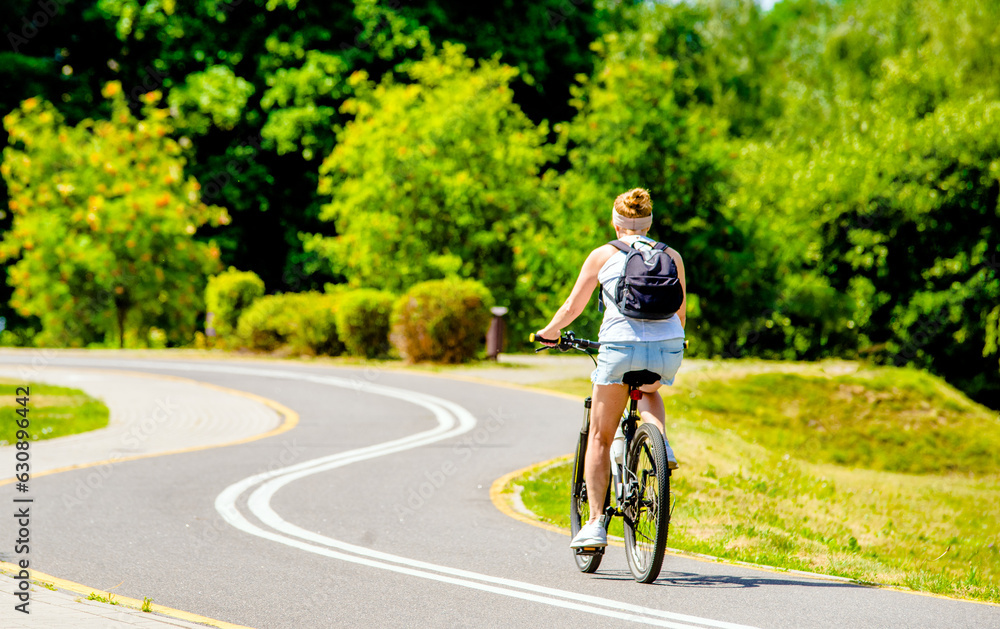 Cyclist ride on the bike path in the city Park
