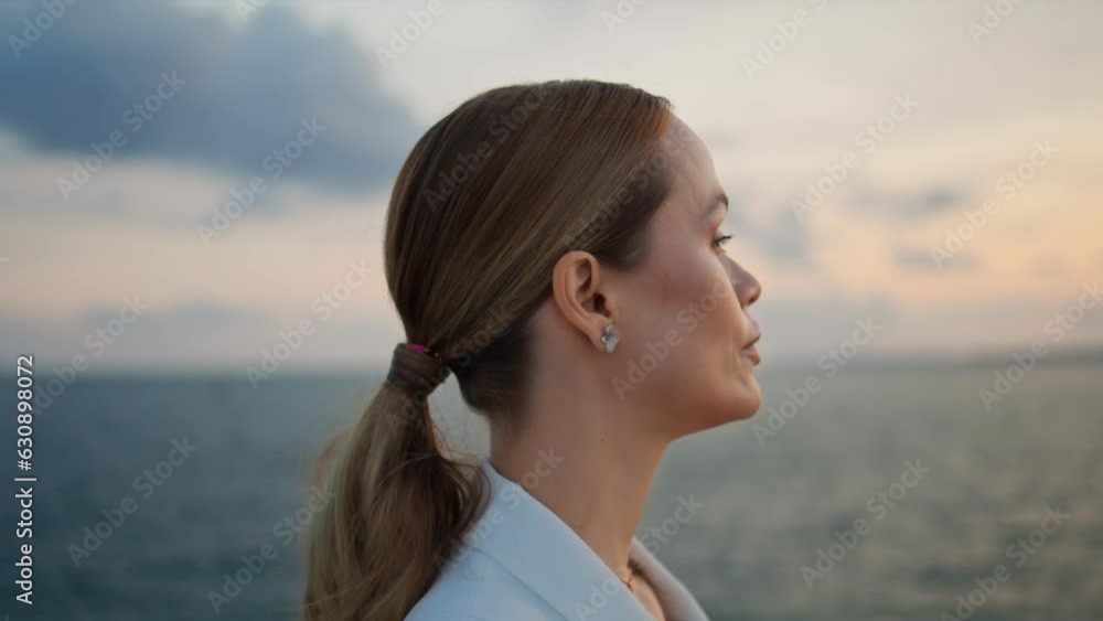 Gorgeous businesswoman admiring sea sunset standing shore closeup. Woman looking Gorgeous businesswoman admiring sea sunset standing shore closeup. Woman looking