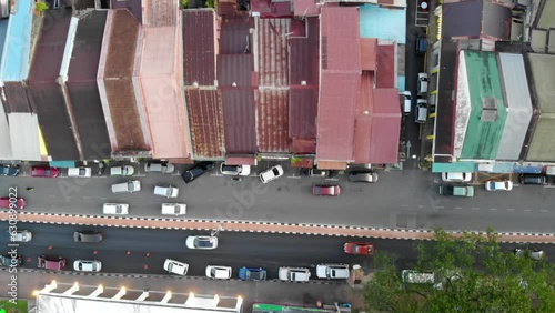 Wallpaper Mural Top aerial view of cars moving on a road nearby colorful houses Torontodigital.ca