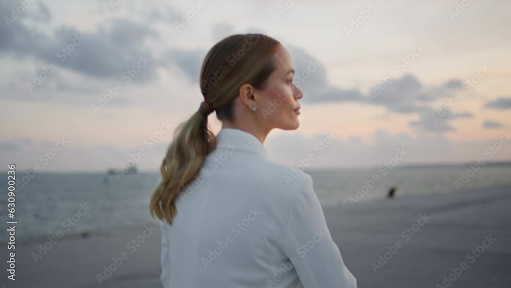 Gorgeous woman enjoy evening beauty walking alone at cloudy embankment close up. Gorgeous woman enjoy evening beauty walking alone at cloudy embankment close up.