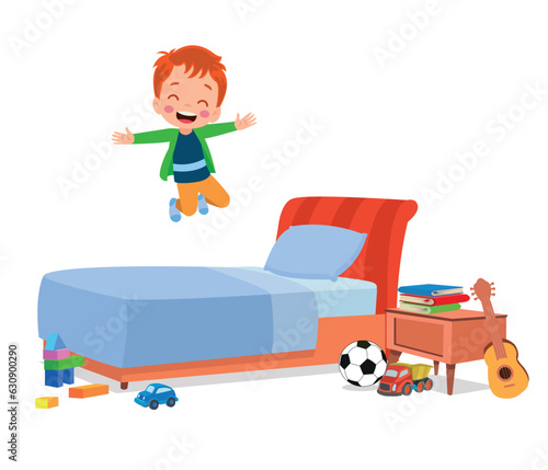 happy cute little kid boy jump on bed