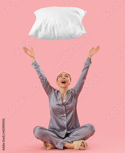 Young woman in pajamas thro...