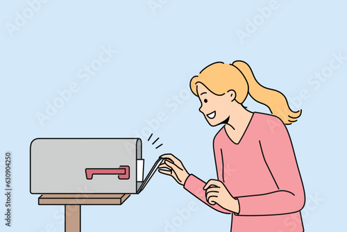 Woman with smile opens street mailbox with letters and rejoices in receiving correspondence or long-term contract. Happy girl near mailbox for important letters for friends and family