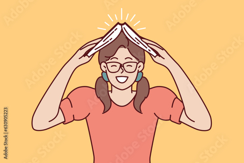 Happy girl student with book over head smile wanting to get new knowledge from textbook. Female student and bookworm to advertise educational goods and services or additional courses