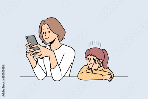 Busy mother does not pay attention to child, being addicted to mobile phone and forgetting about daughter. Woman with smartphone is not engaged in raising child due to lack of time. 