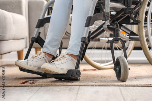 Young woman in wheelchair at home, closeup